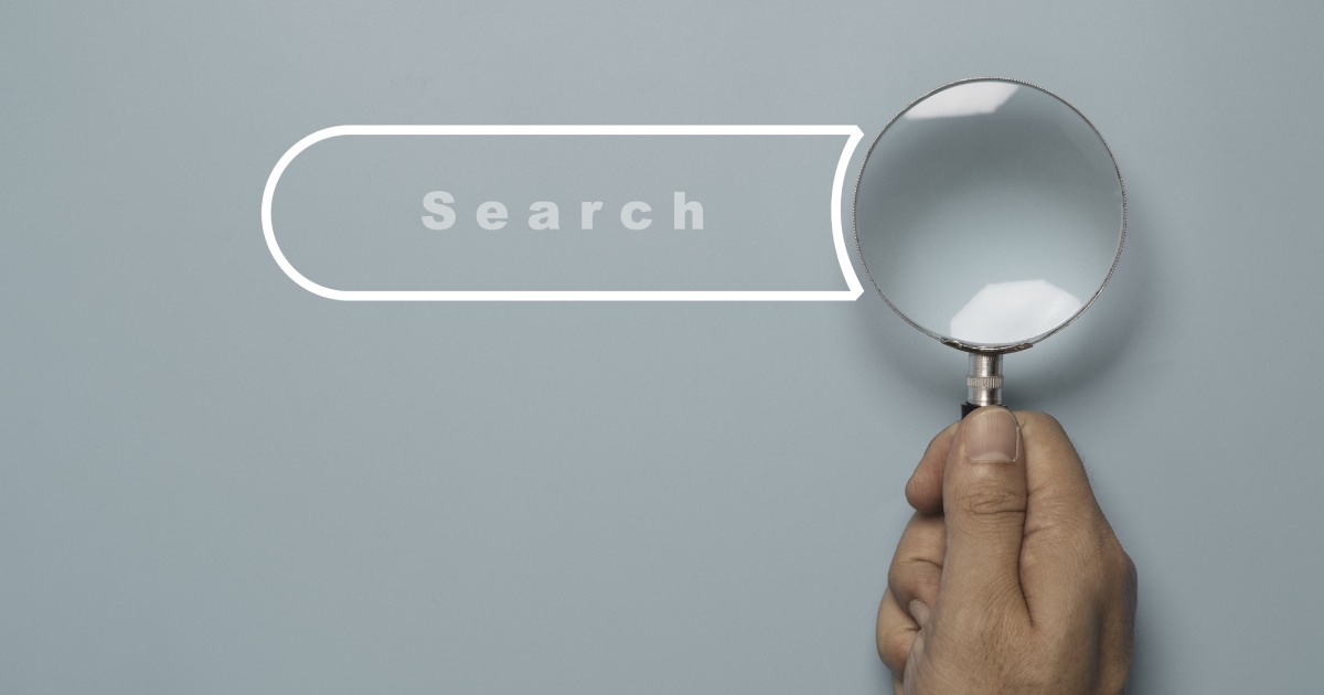 lente di ingrandimento con scritta search